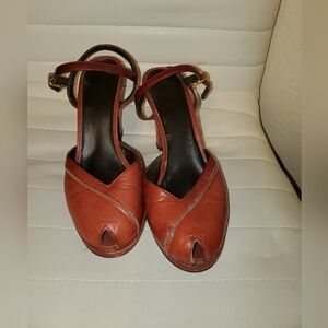 Size 6.5-7 leather peep-toe heels.  Made in Spain.